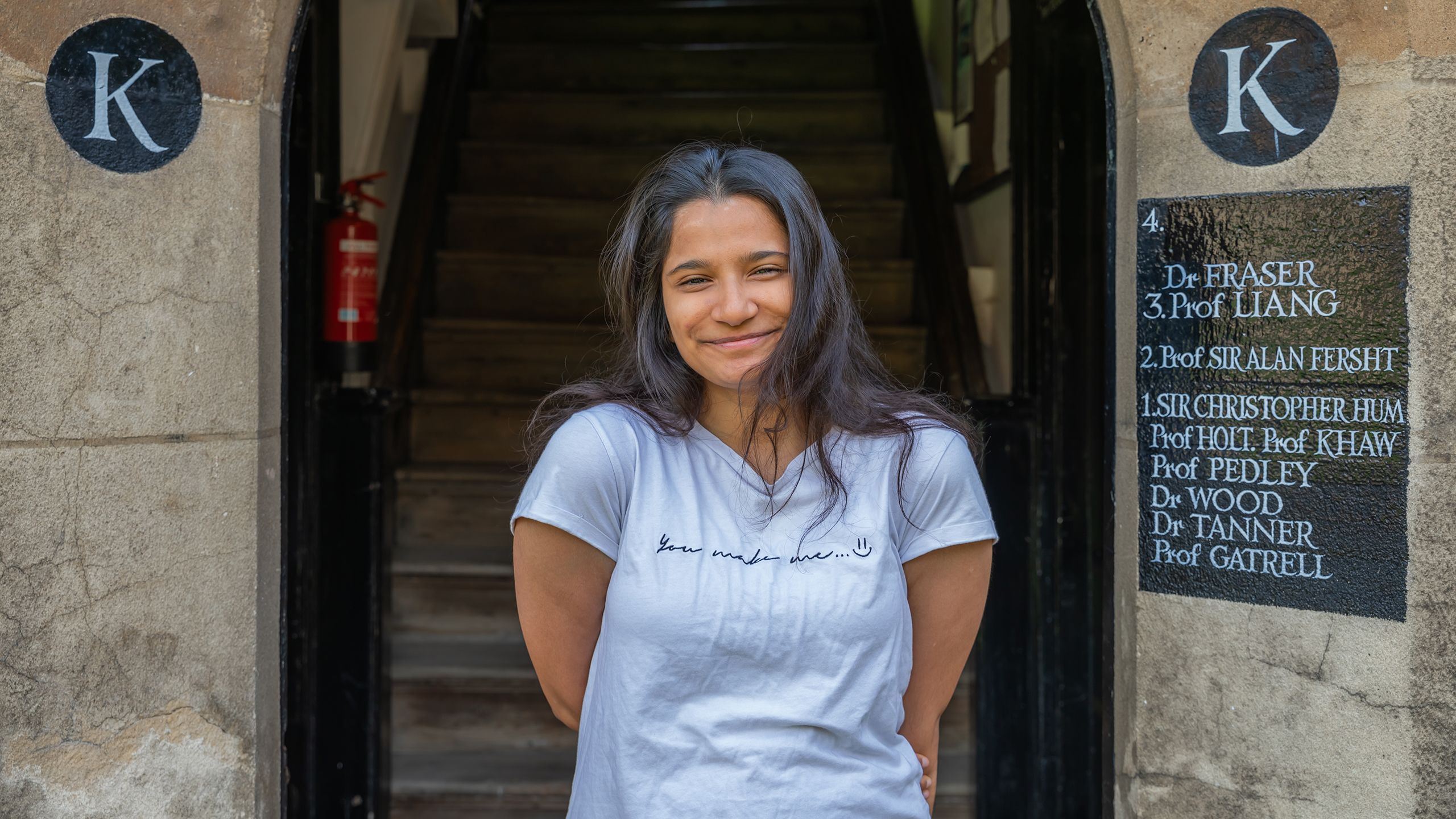 Ashna Biju in front of door