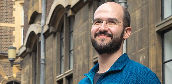 Dr Alex Cagan outside the Department of Genetics