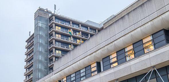 Glassy building credit: Ruben Pinto / iStock / Getty Images Plus via Getty Images https://www.gettyimages.co.uk/detail/photo/front-facade-of-the-hospital-royalty-free-image/641289888?adppopup=true