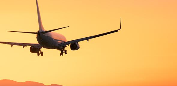 Plane lands at dusk