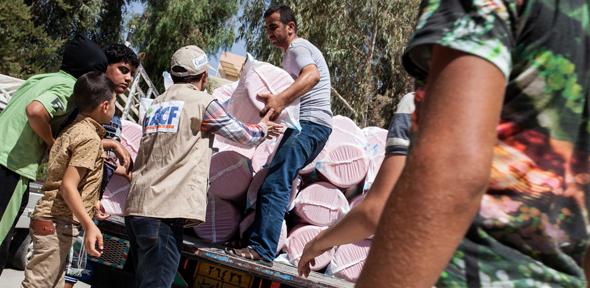 Action Against Hunger team deliver hygiene kits to Iraqi refugees