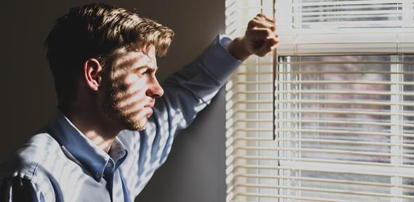 Man looking out of window