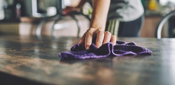 Wiping down the countertop 