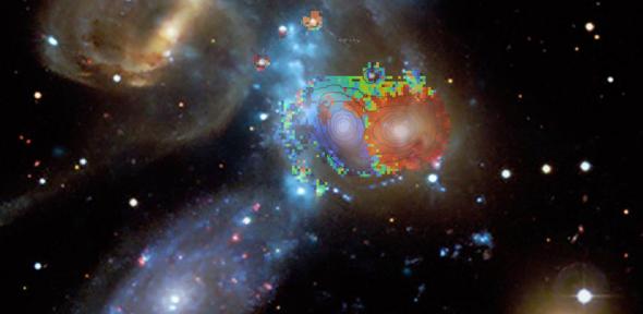 Blue, green and red colours, according to velocities derived from the WEAVE spectra, are overlaid on a composite image of Stephan’s Quintet. 