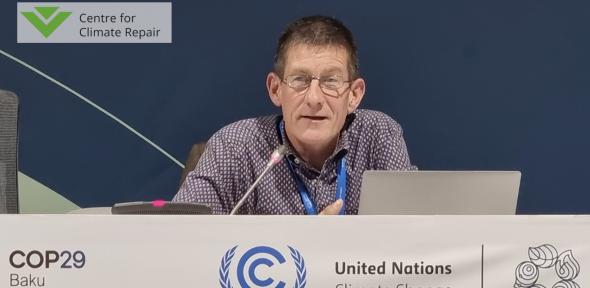 Image of Dr Shaun Fitzgerald speaking at COP29