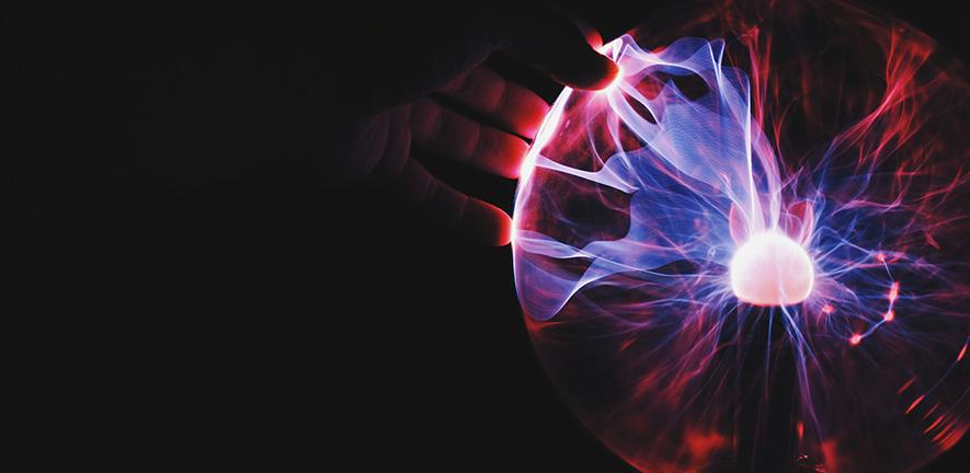 Hand holding plasma ball