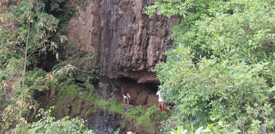 Archaeologists outside the entrance to the Mota cave in the Ethiopian highlands, where the remains containing the ancient genome were discovered. 