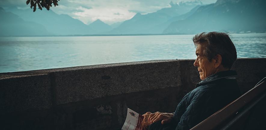 Man sitting holding a book