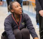 Student using an indoor rowing machine