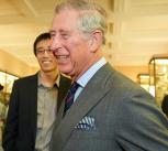 King Charles smiling with a group of Cambridge students