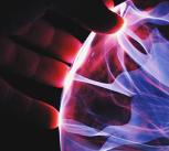 Hand holding plasma ball