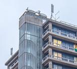 Glassy building credit: Ruben Pinto / iStock / Getty Images Plus via Getty Images https://www.gettyimages.co.uk/detail/photo/front-facade-of-the-hospital-royalty-free-image/641289888?adppopup=true