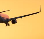 Plane lands at dusk