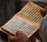 Priest reading Hindu scripts