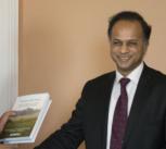 The President of the Republic of Madagascar, Hery Rajaonarimampianina, receiving a copy of Forests and Food during his recent visit to Cambridge