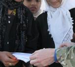 A British army sergeant visits a school in Helmand, Afghanistan.