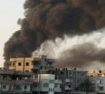 Smoke rises after an Israel air strike in Gaza Strip December 28, 2008.