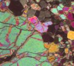 Thin section of igneous rock photographed under a polarising microscope