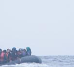 Refugees on a boat crossing the Mediterranean sea, heading from Turkish coast to the northeastern Greek island of Lesbos, 29 January 2016