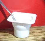 Yoghurt pot under the spotlight.