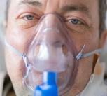 A man with a respirator on his face