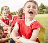 Group of children playing tug of war