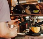 Person using an espresso machine