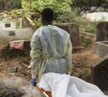 Burial team in Guinea carry a victim of Ebola, 2015. UN Photo/Martine Perret