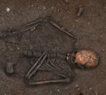 The skeleton of the teenage girl, and the remnants of her burial, as discovered by Cambridge University archaeologists in 2011.