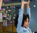 Workers stretching at their desks