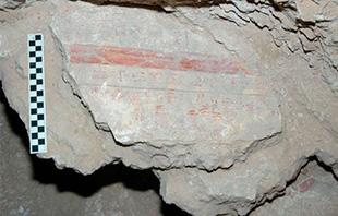 A fragment of the Amduat in situ in the tomb of Thutmose II.