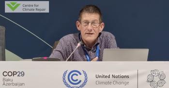 Image of Dr Shaun Fitzgerald speaking at COP29