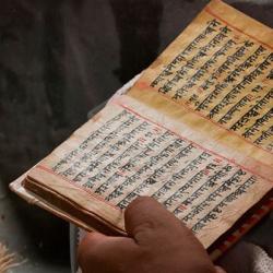 Priest reading Hindu scripts