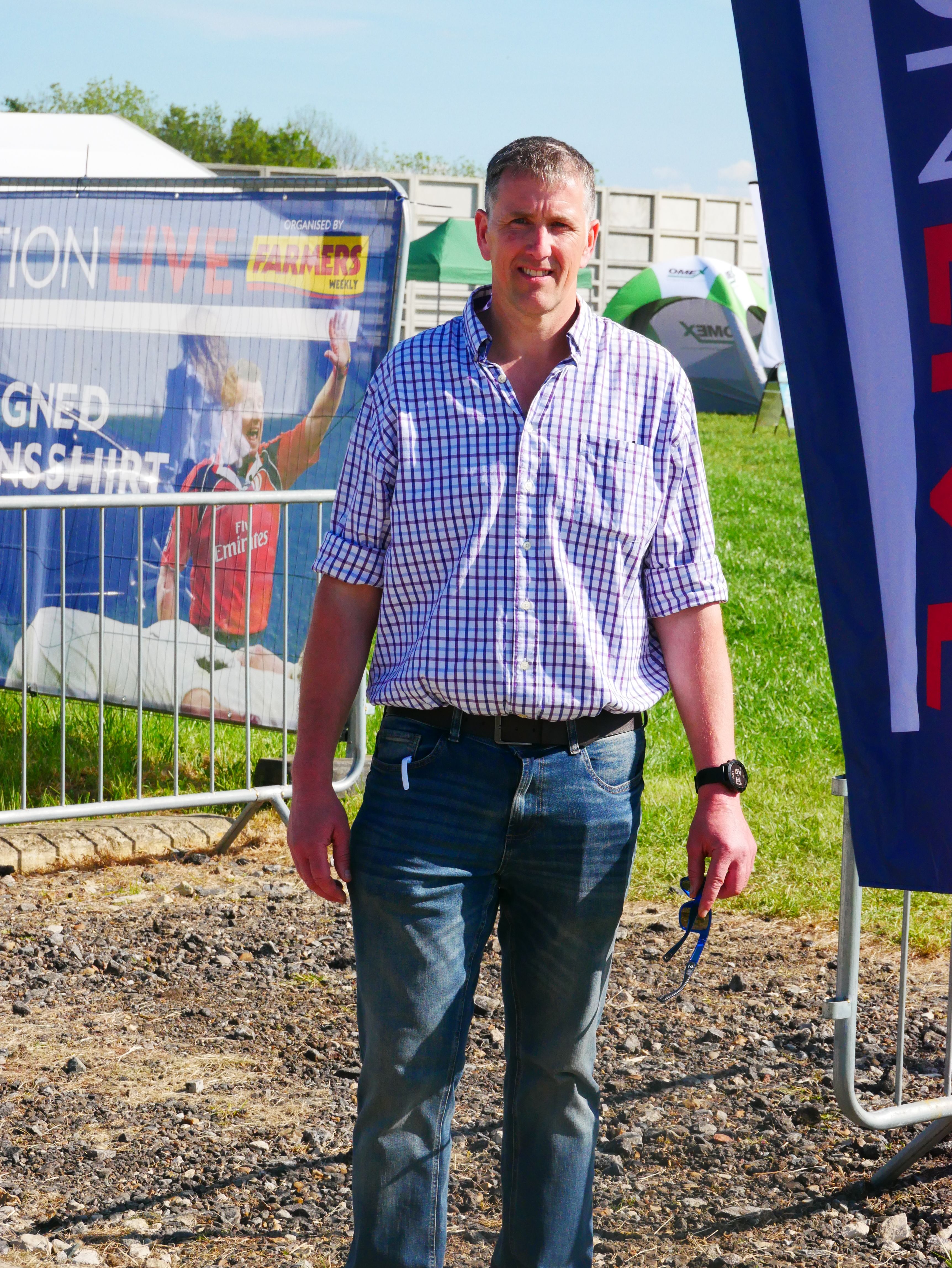 Park Farm Manager Paul Kelly stands next to a Transition Live banner