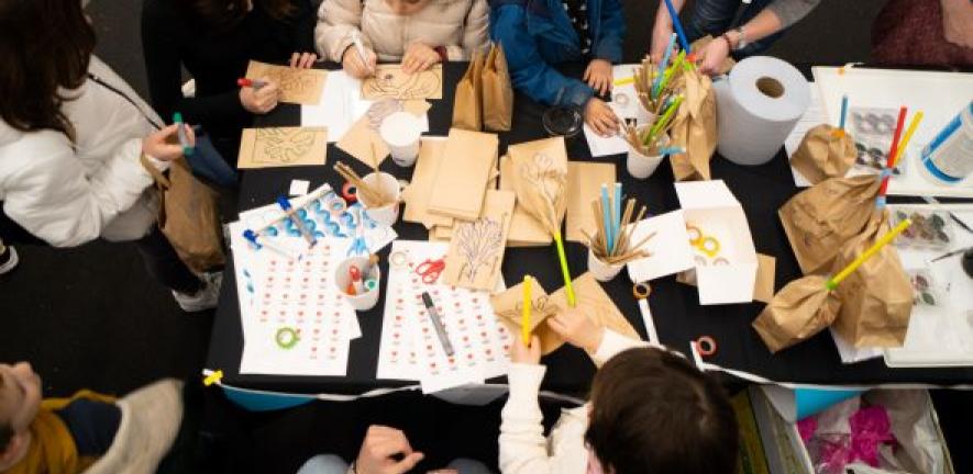 Children and adults taking part in hands-on activities at the Cambridge Festival